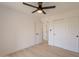 Bright bedroom featuring a ceiling fan, light wood floors and closet with sliding doors at 1609 W Yukon Dr, Phoenix, AZ 85027