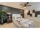 Serene bedroom with a modern accent wall, plush bedding, and stylish decor at 1609 W Yukon Dr, Phoenix, AZ 85027