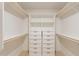 Walk-in closet boasts custom shelving and drawers for optimal organization at 1609 W Yukon Dr, Phoenix, AZ 85027