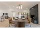 Elegant dining room featuring a fireplace and a large table and chairs and hardwood floors at 1609 W Yukon Dr, Phoenix, AZ 85027