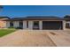 Newly renovated home with a modern desert landscape, fresh exterior paint, and a new roof at 1609 W Yukon Dr, Phoenix, AZ 85027