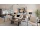 Open concept living room featuring modern furnishings and decor and views of the dining room at 1609 W Yukon Dr, Phoenix, AZ 85027