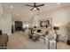 Bright living room featuring vaulted ceilings, modern furnishings, and an open floor plan at 1609 W Yukon Dr, Phoenix, AZ 85027