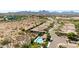 Aerial view showcasing the home, pool area, surrounding desert landscape, and mountain backdrop at 16538 E Westwind Ct # 51, Fountain Hills, AZ 85268