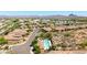 Elevated view showcases a neighborhood, pool, homes, and desert landscape at 16538 E Westwind Ct # 51, Fountain Hills, AZ 85268