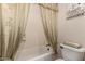 Cozy bathroom featuring shower and tub combo with decorative neutral-toned curtain at 16538 E Westwind Ct # 51, Fountain Hills, AZ 85268