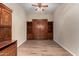 Bedroom with a built in wood Murphy bed flanked by shelves, wood floors and ceiling fan at 16538 E Westwind Ct # 51, Fountain Hills, AZ 85268