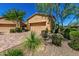 Landscaped front yard with pavers, decorative plants, and a beige home with tile roof in the background at 16538 E Westwind Ct # 51, Fountain Hills, AZ 85268