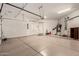 Spacious garage with epoxy flooring, water heater, storage, and garage door opener at 16538 E Westwind Ct # 51, Fountain Hills, AZ 85268