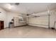 Spacious garage with cabinets, shelving and automatic garage door at 16538 E Westwind Ct # 51, Fountain Hills, AZ 85268