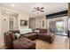Spacious living room featuring a comfortable sectional couch, ceiling fan, and sliding glass doors to the outdoor space at 16538 E Westwind Ct # 51, Fountain Hills, AZ 85268