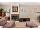 Living room featuring fireplace, decorative windows, and tile floors at 16538 E Westwind Ct # 51, Fountain Hills, AZ 85268