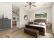 Serene main bedroom with a king-sized bed, ensuite bathroom access, and views to the outdoor area at 16538 E Westwind Ct # 51, Fountain Hills, AZ 85268