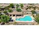Beautiful pool area with a covered patio, lounge chairs, and well-maintained landscaping at 16538 E Westwind Ct # 51, Fountain Hills, AZ 85268
