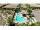 Gorgeous freeform pool with a spa, shaded ramada, and poolside seating at 16538 E Westwind Ct # 51, Fountain Hills, AZ 85268
