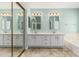 Bathroom featuring a double sink vanity with tile floors at 1705 W Lark Dr, Chandler, AZ 85286