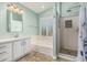 Bathroom showcasing a soaking tub, walk-in shower, and vanity at 1705 W Lark Dr, Chandler, AZ 85286