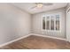 Bedroom with wood floors and window shutters at 1705 W Lark Dr, Chandler, AZ 85286