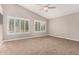 Vaulted ceiling bedroom with neutral paint, carpet, and window shutters at 1705 W Lark Dr, Chandler, AZ 85286