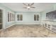 Bright bonus room features neutral walls, tile flooring, a ceiling fan, and plantation shutters at 1705 W Lark Dr, Chandler, AZ 85286