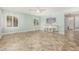 Large bonus room with tile floors, neutral walls, a ceiling fan, and ample natural light at 1705 W Lark Dr, Chandler, AZ 85286