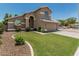 Charming home featuring a well-maintained lawn, mature landscaping, and a two-car garage at 1705 W Lark Dr, Chandler, AZ 85286