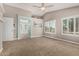 Large bedroom with carpet, neutral color walls, and view of an ensuite bathroom at 1705 W Lark Dr, Chandler, AZ 85286