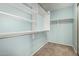 Walk-in closet with shelving, and wall mounted clothing racks at 1705 W Lark Dr, Chandler, AZ 85286