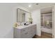 Bathroom with double sink vanity, marble countertop, and a view to the shower at 1730 W Emelita Ave # 2033, Mesa, AZ 85202