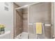 Bathroom shower with updated tile, sliding doors, and modern fixtures at 1730 W Emelita Ave # 2033, Mesa, AZ 85202