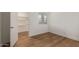 Empty bedroom featuring laminate flooring and closet at 1730 W Emelita Ave # 2033, Mesa, AZ 85202