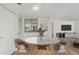 Dining area showcasing wood floors, a marble top table with seating for four, and natural light at 1730 W Emelita Ave # 2033, Mesa, AZ 85202