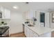 Bright kitchen with stainless steel appliances, white cabinets, and marble countertops at 1730 W Emelita Ave # 2033, Mesa, AZ 85202