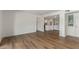 Inviting living room showcasing modern flooring, adjacent kitchen, and natural light at 1730 W Emelita Ave # 2033, Mesa, AZ 85202