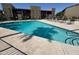 Beautiful community swimming pool with lounge chairs at 1730 W Emelita Ave # 2033, Mesa, AZ 85202