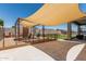Spacious backyard featuring a playground, artificial grass and a patio for outdoor activities at 17980 W Meadowbrook Ave, Goodyear, AZ 85395