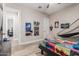 Bedroom with a playful theme, colorful bedding, and view into another room at 17980 W Meadowbrook Ave, Goodyear, AZ 85395