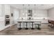 Bright kitchen features a spacious island, stainless appliances, and pendant lighting at 17980 W Meadowbrook Ave, Goodyear, AZ 85395
