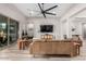 Bright living room featuring wood floors, neutral walls, and modern furniture at 17980 W Meadowbrook Ave, Goodyear, AZ 85395