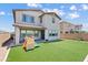 This home features a spacious backyard with artificial turf and a covered patio, ideal for outdoor entertaining at 1800 S Jesse Pl, Chandler, AZ 85286