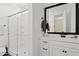 The bathroom features a glass-enclosed shower and white vanity with black hardware at 1800 S Jesse Pl, Chandler, AZ 85286
