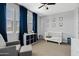 Cozy bedroom with blue accents, neutral walls, bright windows, and carpet floors, perfect for a Bedroom at 1800 S Jesse Pl, Chandler, AZ 85286