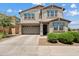 Charming two-story home featuring a well-maintained lawn, a two car garage, and inviting curb appeal at 1800 S Jesse Pl, Chandler, AZ 85286