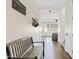 A hallway with a bench seat and decor leads to the living room at 1800 S Jesse Pl, Chandler, AZ 85286