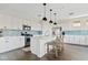 The Kitchen features a large center island with seating, stainless steel appliances and blue backsplash at 1800 S Jesse Pl, Chandler, AZ 85286