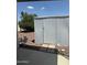 The outdoor storage space includes an outbuilding and landscaping with trees and rock at 201 S Greenfield Rd # 118, Mesa, AZ 85206