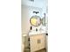 Bathroom showcasing modern vanity, round mirror, black hardware, and a stylish plant at 20917 N 37Th Pl, Phoenix, AZ 85050