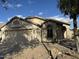 Charming single-story home with neutral stucco exterior, arched entry, and a well-maintained landscaped front yard at 20917 N 37Th Pl, Phoenix, AZ 85050
