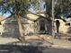 Charming single-story home with neutral stucco exterior, arched entry, and a well-maintained landscaped front yard at 20917 N 37Th Pl, Phoenix, AZ 85050