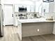 Updated kitchen with stylish cabinets, quartz counters, and modern stainless appliances at 20917 N 37Th Pl, Phoenix, AZ 85050